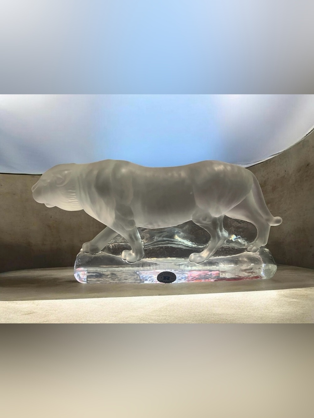 This is a Reijmyre Sweden frosted glass tiger sculpture on a clear base.